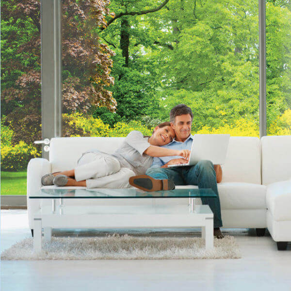 Panorama window film for solar safety shown in living room with couple